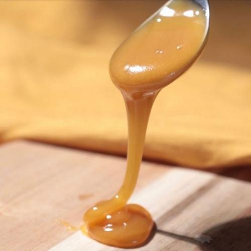 pure new zealand honey on spoon